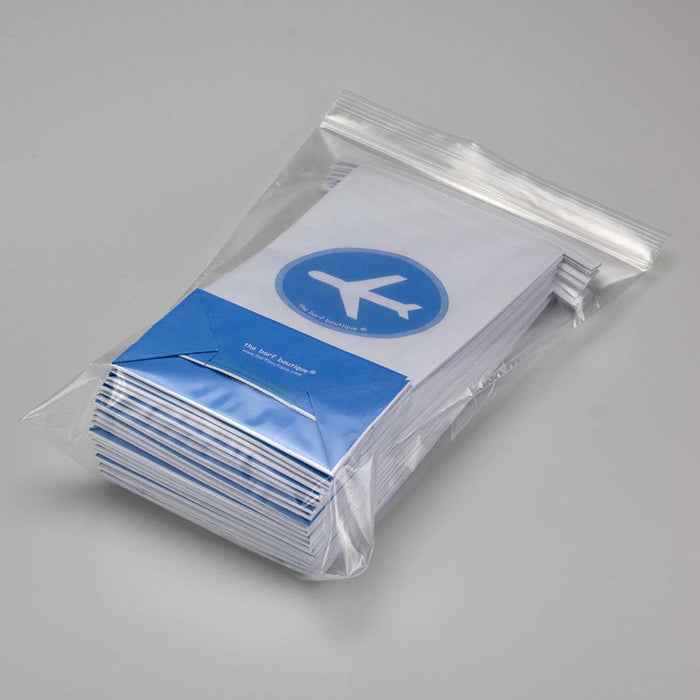 plastic bag with 25 airplane puke bags with a blue plane logo on front