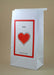 kid's vomit barf bag with a picture of a heart and the word love by The Barf Boutique